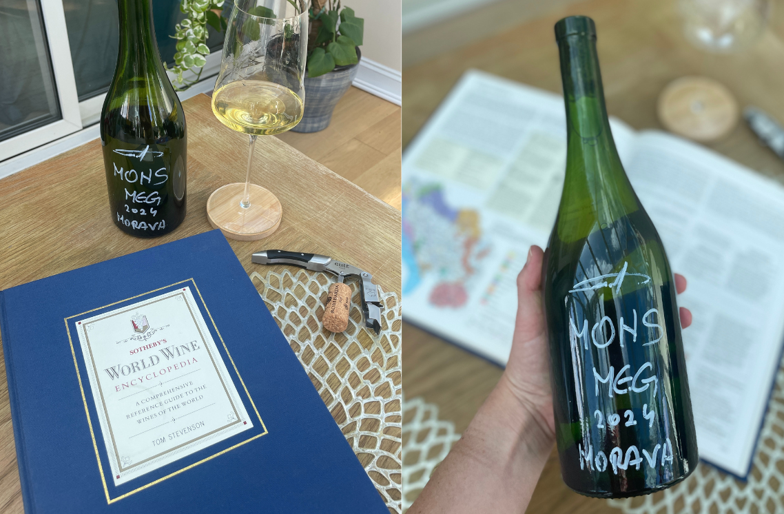 Sotheby’s World Wine Encyclopedia next to a bottle of Mons Meg Morava 2024 by Bombarda 929